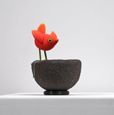 orange bird on black nest I by Chris Barnes
