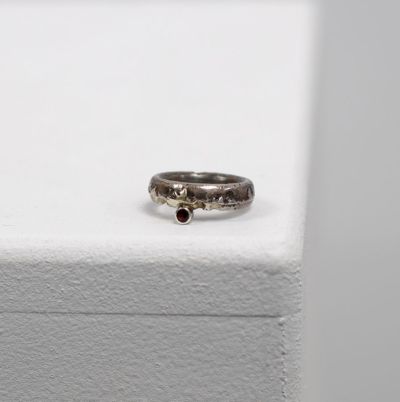 silver and gold garnet ring by ruth hollick