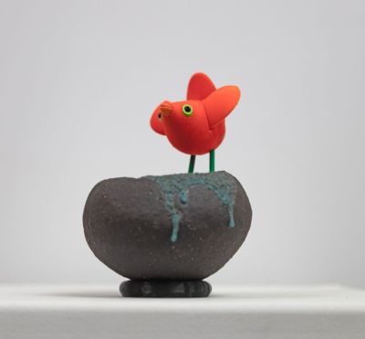 orange bird on black nest II by Chris Barnes